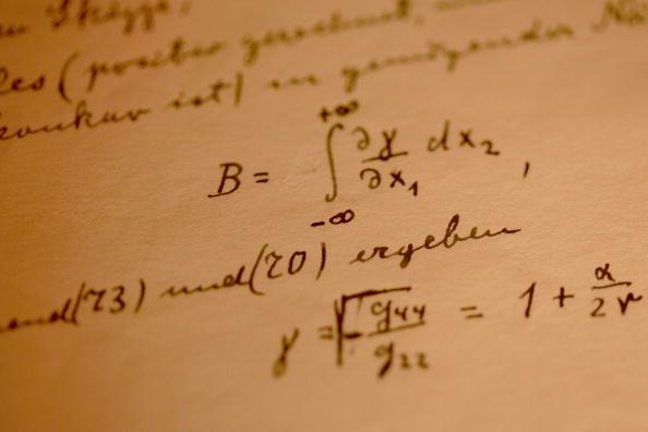 JERUSALEM - MARCH 09:  A detail from Albert Einstein's General Theory of Relativity which is on display in its entirety for the first time, at the Israeli Academy of Sciences and Humanities on March 9, 2010 in Jerusalem, Israel. Einstein donated the complete original forty-six page handwritten manuscript of his ground-breaking theory to The Hebrew University of Jerusalem during its inauguration in 1925.  (Photo by David Silverman/Getty Images)