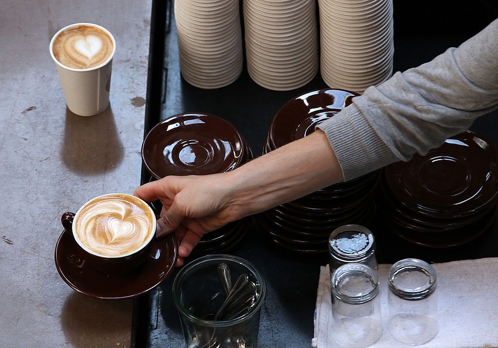 SAN FRANCISCO, CA - AUGUST 26: A barista at Sightglass Coffee makes a coffee drink on August 26, 2011 in San Francisco, California. Coffee shops across the country are being faced with the decision to raise retail coffee prices as wholesale coffee bean prices are surging. According to the International Coffee Organization, the daily average composite price of coffee beans has gone up nearly every day over the last 12 days. (Photo by Justin Sullivan/Getty Images)
