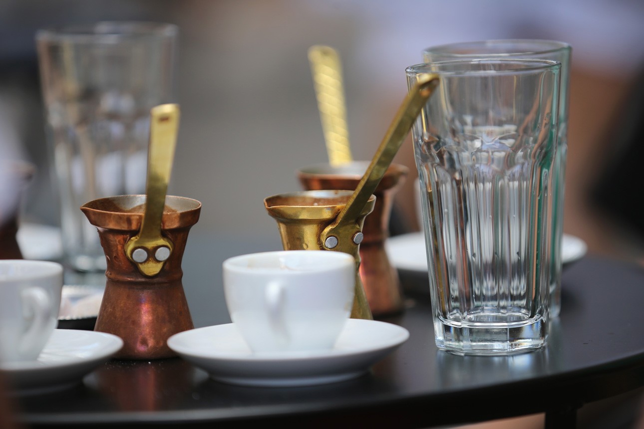 ATHENS, GREECE - JULY 04: Greek coffee pots sit on the table of a street cafe on the eve of Greece's austerity vote on July 4, 2015 in Athens, Greece. The people of Greece are preparing to vote in the referendum that will decide the fate of the austerity negotiations between Greece and its creditors. Greek Prime Minister Alexis Tsipras addressed supporters in Syntagma Square last night, urging people to vote "a proud no" to European creditors' proposals, and "live with dignity in Europe". 'Yes' campaigners believe that a no vote would mean financial ruin for Greece and the loss of the Euro currency. (Photo by Christopher Furlong/Getty Images)