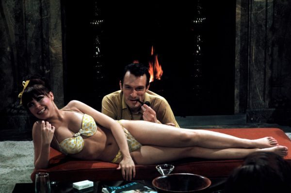 USA. Las Vegas, Nevada. 1966. Playboy founder Hugh HEFNER with a Playboy bunny at his mansion.