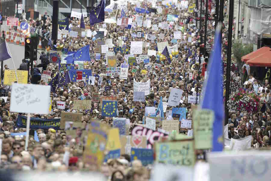 People hold banners during a demonstration against Britain's decision to leave the European Union, in central London