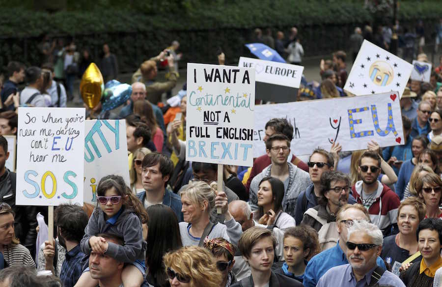 People hold banners during a demonstration against Britain's decision to leave the European Union, in central London