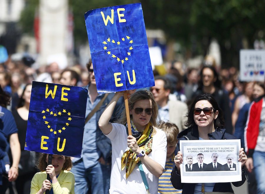 People hold banners during a demonstration against Britain's decision to leave the European Union, in central London