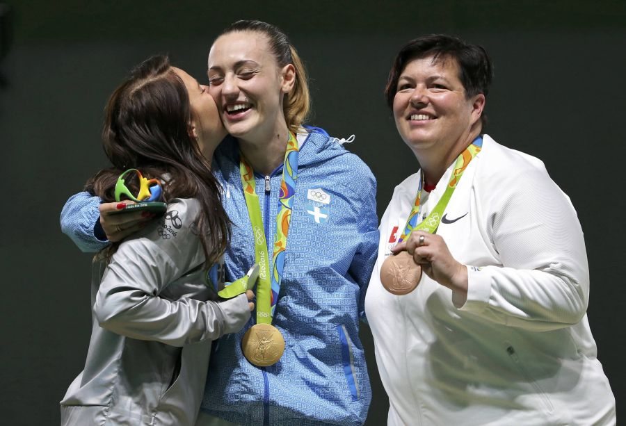 2016 Rio Olympics - Shooting - Victory Ceremony - Women's 25m Pistol Victory Ceremony - Olympic Shooting Centre - Rio de Janeiro, Brazil - 09/08/2016. (L-R) Monika Karsch (GER) of Germany, Anna Korakaki (GRE) of Greece, Heidi Diethelm Gerber (SUI) of Switzerland celebrate with their medals. REUTERS/Edgard Garrido FOR EDITORIAL USE ONLY. NOT FOR SALE FOR MARKETING OR ADVERTISING CAMPAIGNS.