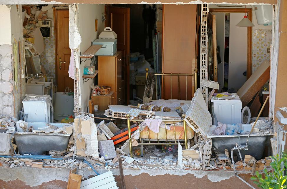 The interior of an house is seen in Amatrice, following an earthquake, central Italy. Hardly a single building was left unscathed in Amatrice, which was last year voted one of the most beautiful old towns in Italy and is famous for its local cuisine. REUTERS/Stefano Rellandini