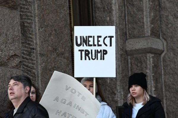Activists demonstrate against U.S. President-elect Donald Trump outside the Texas State Capitol in Austin, one day ahead of the meetings of the Electoral College in the U.S., December 18, 2016. REUTERS/Mohammad Khursheed
