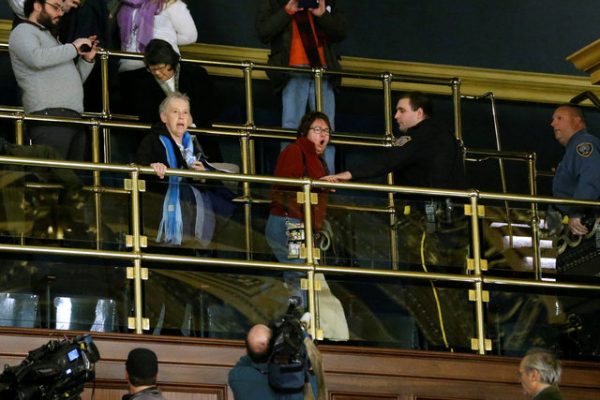 Protesters shout in anger from the gallery at Pennsylvania electors after they cast their votes for U.S. President-elect Donald Trump at the Pennsylvania State Capitol in Harrisburg, Pennsylvania, U.S. December 19, 2016. REUTERS/Jonathan Ernst