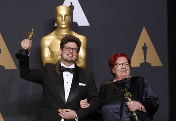 89th Academy Awards - Oscars Backstage - Hollywood, California, U.S. - 26/02/17 - Orlando von Einsiedel and Joanna Natasegara pose with their Oscars for Best Documentary Short Subject for "The White Helmets" REUTERS/Lucas Jackson