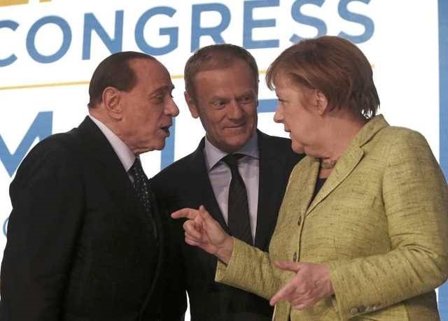 (L-R) Former Italian Prime Minister Silvio Berlusconi, European Council President Donald Tusk and German Chancellor Angela Merkel take part in a European People Party (EPP) summit in St Julian's, Malta, March 30, 2017. REUTERS/Darrin Zammit Lupi