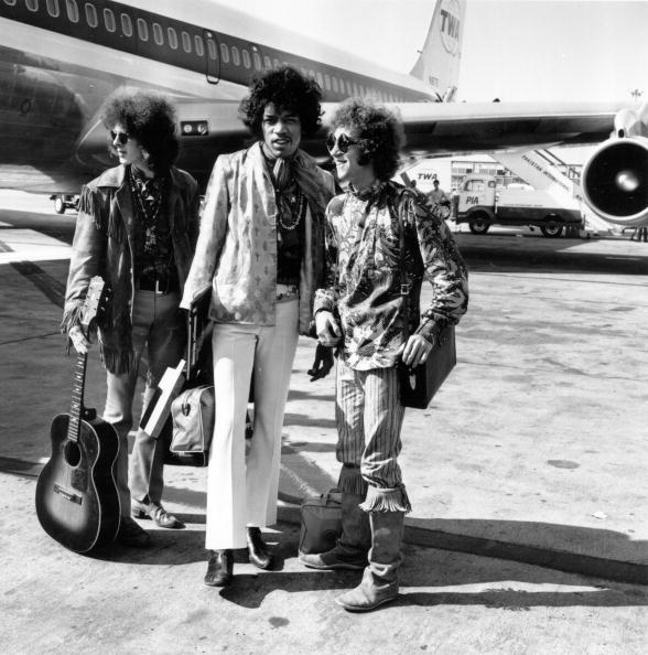 21st August 1967: Popular rock trio the Jimi Hendrix Experience at London Airport with their hand luggage. They are, from left to right; Noel Redding (1945 - 2003), bass player, Jimi Hendrix, singer, guitarist and songwriter, and Mitch Mitchell, drummer. (Photo by Express/Express/Getty Images)
