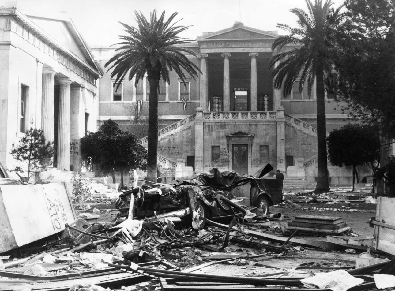20th November 1973: Burnt-out cars, furniture and other debris in the square outside Athens Polytechnic after a night of street battles around the time of the counter-coup which ousted Papadopoulos during the regime of the Greek Colonels. (Photo by Keystone/Getty Images)