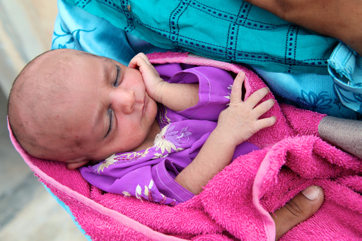 PHOTOGRAPHER'S CAPTION. DO NOT DISTRIBUTE. March 2016, village Khan Pur Baga Sher, Muzuffragrah District, Punjab Pakistan. At local health house a new born baby